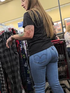Girl with tattoos in tight jeans