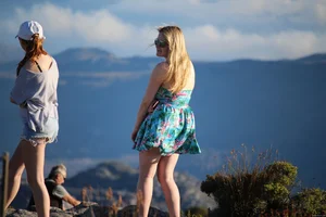 Thick blonde showing her ass and thong when wind blows her skirt up