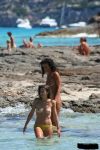 Nude beach ladies in the water showing their tits