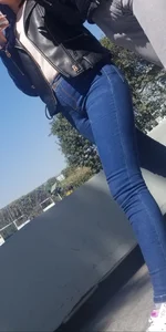 Girl in jeans walking with her boyfriend