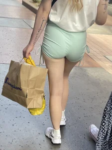 Sexy blonde in green shorts