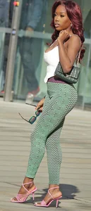 Slim ebony teens in leggings posing in the sun