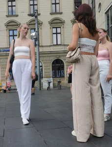 Long blonde braless in a white outfit (many pictures)
