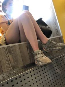 Cute Teen Delivery Girl in Shorts And Dirty Sneakers Sitting on a Windowsill Restaurant Creepshots Gallery