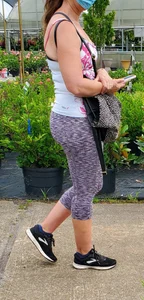 Milf booty in tight leggings shopping for plants