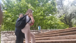 Sexy ass in tight pants on the street stairs creepshots