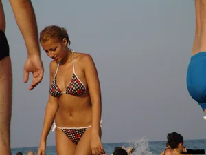 A bunch of sexy beach voyeur babes in bikinis, thongs and topless