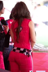 Beautiful and sexy Toyota car girl in red leggings