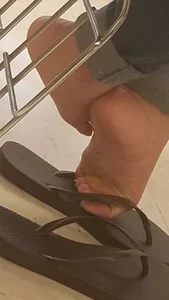 College Girl's Feet in Slippers Under Desk Closeup Photos