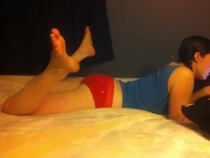 Unsuspecting girls lying on stomach