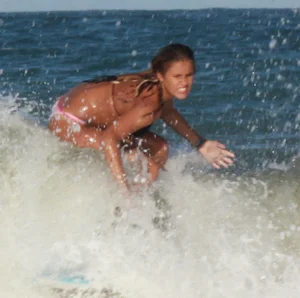 Hot surfer chicks out in the water