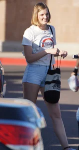 College babe in the parking lot in little denim shorts