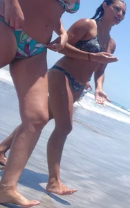Thick and skinny sexy friends on the beach in bikinis