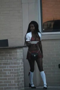 Sexy ebony Tilted Kilt employee in her uniform