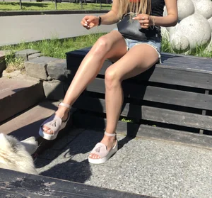 Girl in Denim Shorts with Amazing Hot Legs Fixing Her Sandals Street Candid Photo Gallery