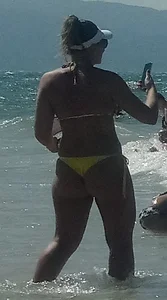 Big booty white chick in a yellow thong at the beach