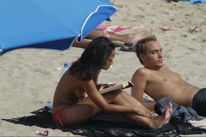 Girls on a nude beach in Sitges, Spain
