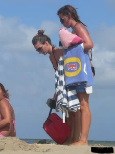 Sexy beach lady in tiny brown thong bikini with a nice ass