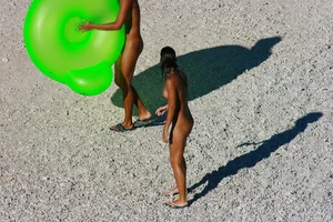FKK Nudists playing in the water with floater