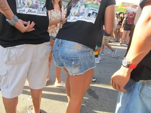 Brunette babe standing around in denim shorts