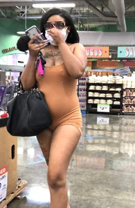Latina with hard nipples and a big booty in tight spandex shorts outfit