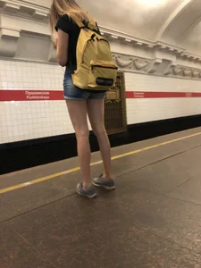 Cute Skinny Teen in Jean Mini Shorts Standing on the Subway Platform