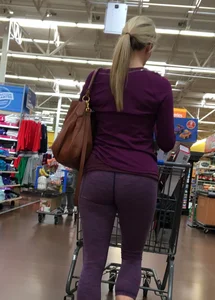 Sexy blonde shopping at Walmart in purple leggings with some vpl