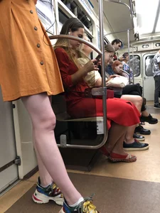 Cute Teen Girl in a Dress With Slim Legs Standing in the Subway Train, Then Crossing the Street Photo Gallery