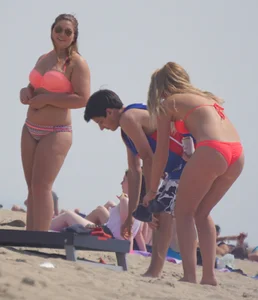 Sexy thick blonde girl with tiny bikini and big booty on the beach