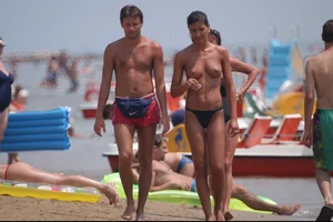 Girls on a nude beach in Bibione, Italy
