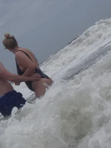 Thick blonde on the beach with a big booty in a blue swimsuit