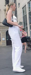Long blonde braless in a white outfit (many pictures)