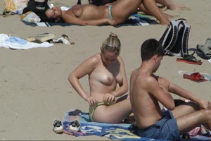 Girls on a nude beach in Sitges, Spain