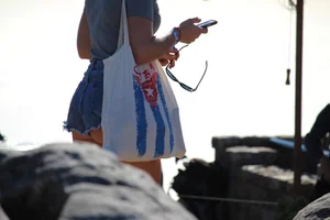 Sexy tourist in short jean shorts showing cheeks
