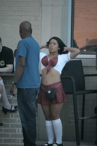 Two sexy Tilted Kilt employees showing cleavage and cheeks