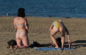 Ladies literally making out on beach