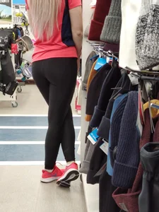 Cute Girl in Yoga Pants in a Store Candid Photo