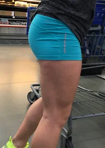 Big booty girl in blue spandex shorts shopping