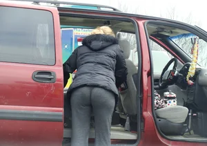 Girls cleaning their cars in jeans and pants