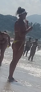 Big booty white chick in a yellow thong at the beach
