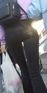 Juicy ass in black tight jeans and nice skinny legs street closeups