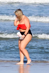 Thick BBW blonde lady in a bikini at the beach