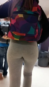 Cute college girl wearing grey leggings