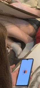 Artist Teen Student in Shorts And White Socks Curled Up on the Couch Legs Closeup