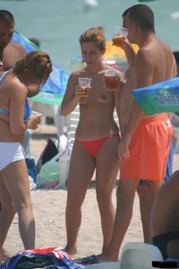 A bunch of sexy beach voyeur babes in bikinis, thongs and topless