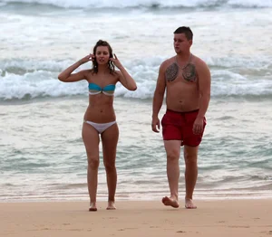 Cute beach girl with decent body in bikini