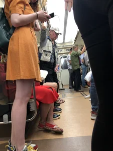 Cute Teen Girl in a Dress With Slim Legs Standing in the Subway Train, Then Crossing the Street Photo Gallery