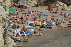 Girls on a nude beach in Sitges, Spain