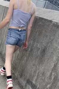 Tight ass in grey jean shorts.