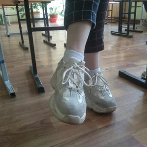 Cute College Girl in Sneakers Closeups Under Table